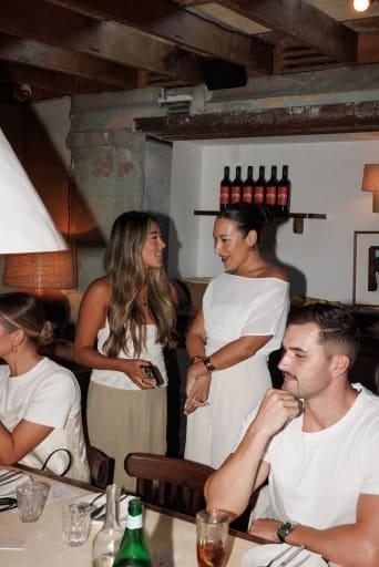 Guests talking across the room before service