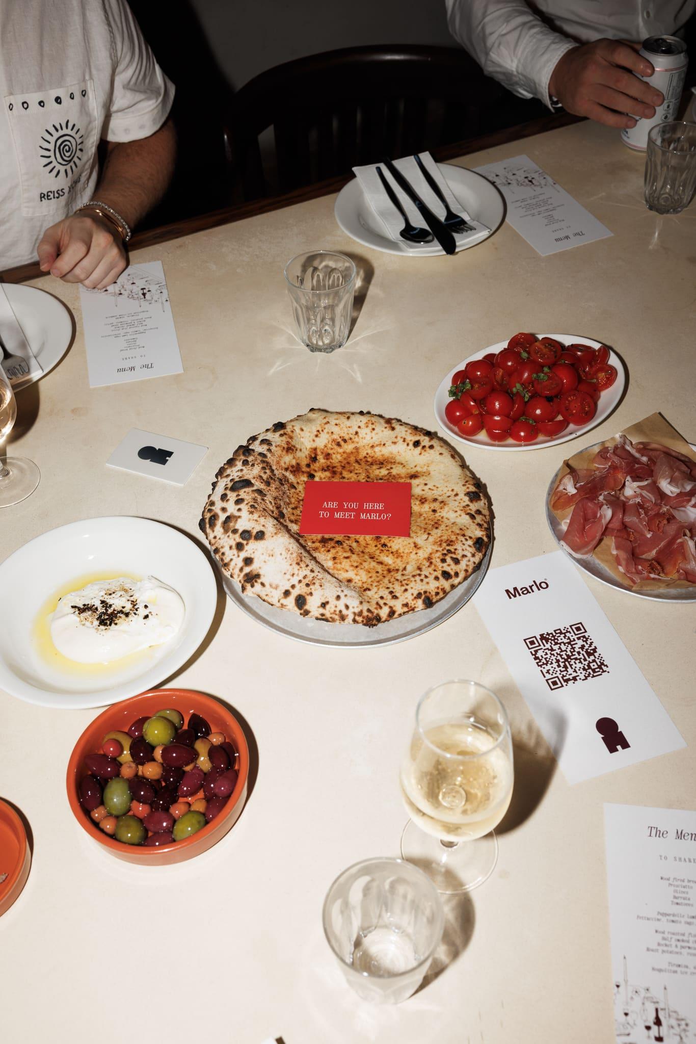 Food and Marlo campaign cards across a restaurant table
